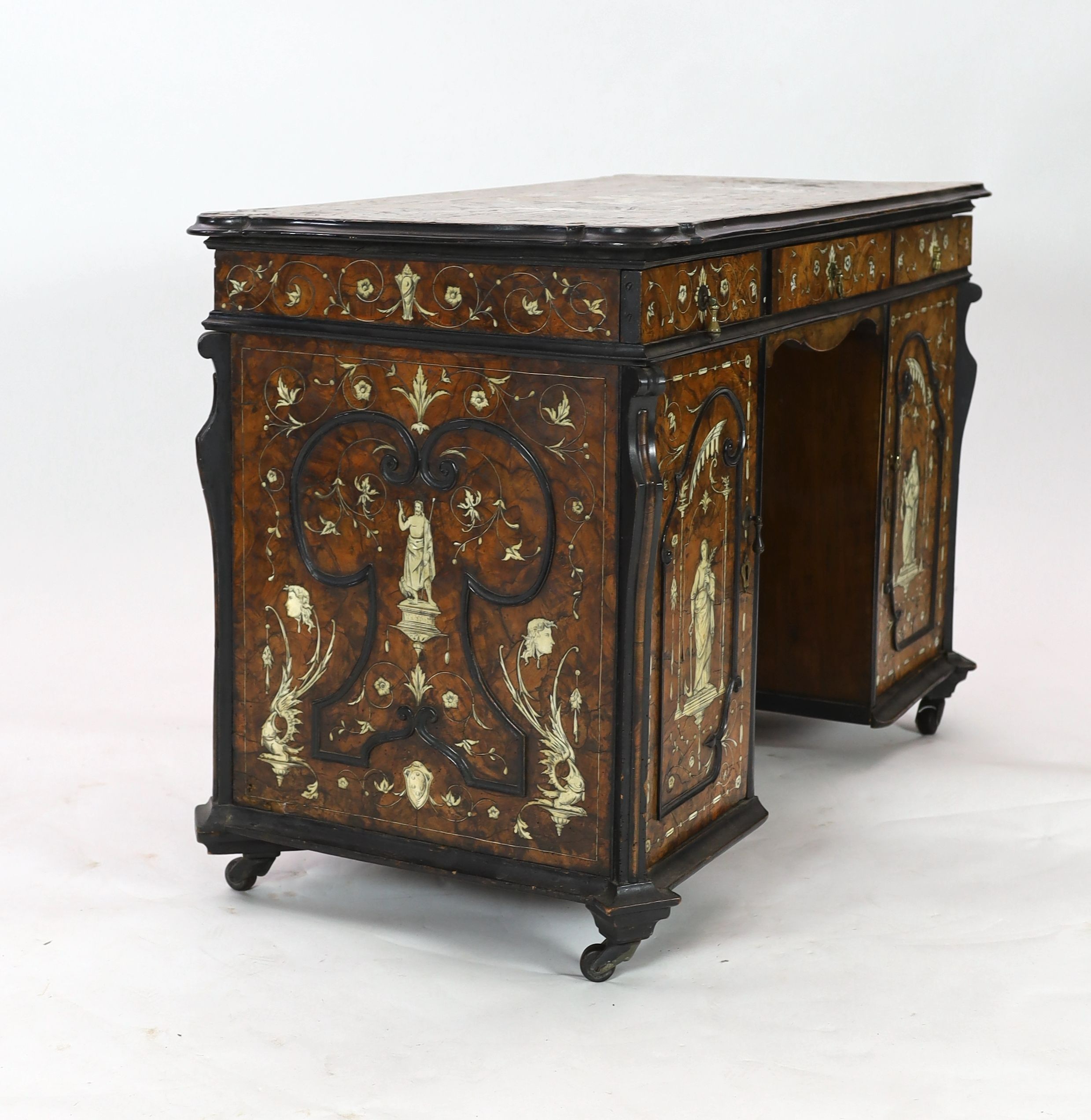 An important 18th century Lombardy ebony banded walnut and ivory inlaid twin pedestal desk, the top and sides inlaid with a scenes from Homer’s Iliad, after original drawings by John Flaxman RA (1755-1826), width 118cm d